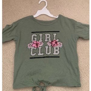 A cute green shirt with sequin material